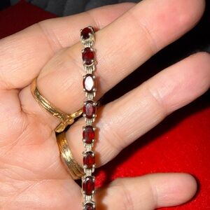 Elegant Sterling silver garnet tennis bracelet with clasp